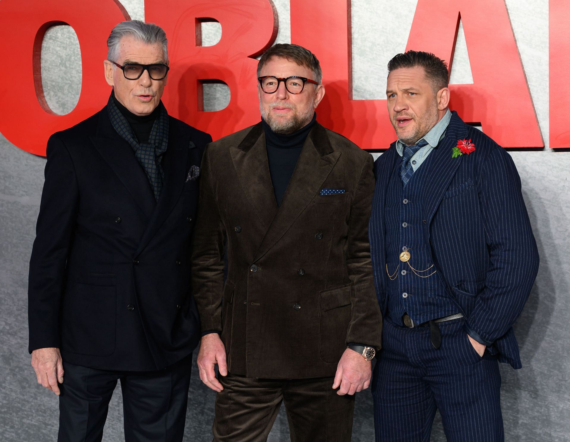 Pierce Brosnan, Guy Ritchie, and Tom Hardy attend the MobLand Global Premiere at the Odeon Luxe Leicester Square on March 27, 2025, in London, England. (Image via Getty)